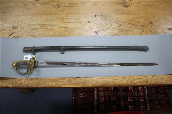 A Victorian infantry officers sword, the polished etched blade by J.B. Johnstone, gilt hilt and brass scabbard, blade 84cm, overall le